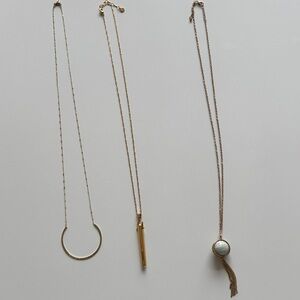 Lot of 3 long gold toned necklaces.  Each about 16 inches long.
